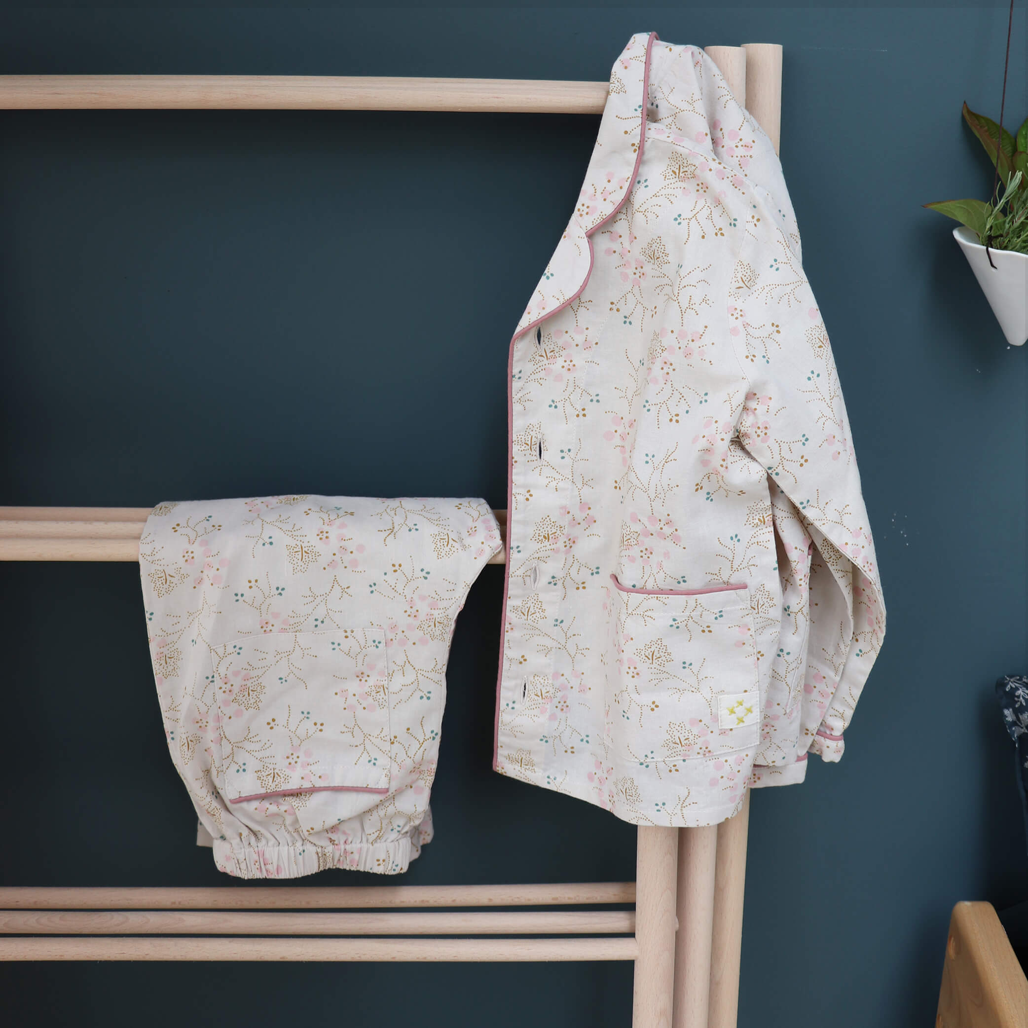 Girls 100% soft cotton pyjamas with beautiful piping detail and front pockets, comes in a muslin bag for storage or gifting printed in Minako golden by camomile london