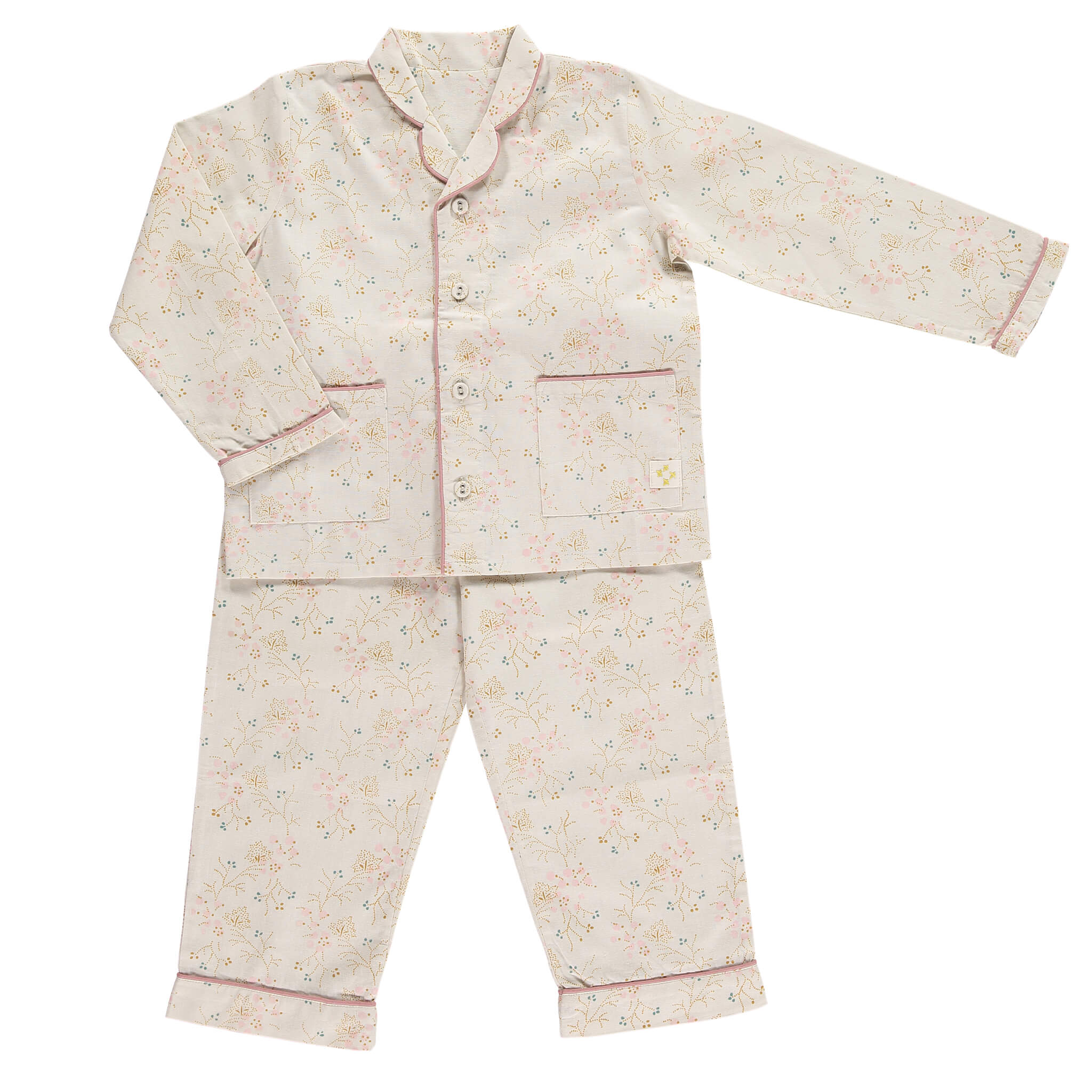 Girls 100% soft cotton pyjamas with beautiful piping detail and front pockets, comes in a muslin bag for storage or gifting printed in Minako golden by camomile london